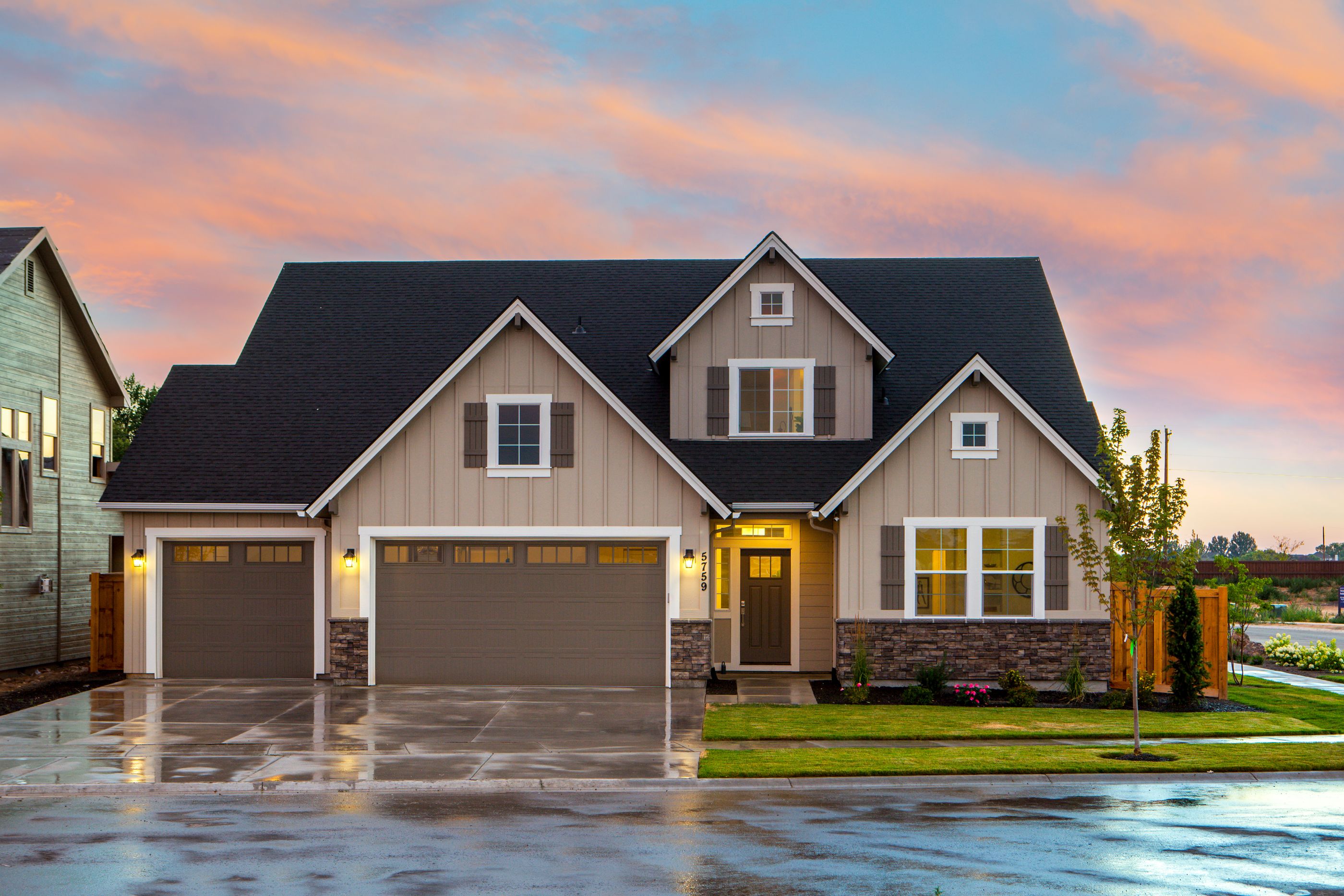 Two-storey home in Aspen Woods at dusk