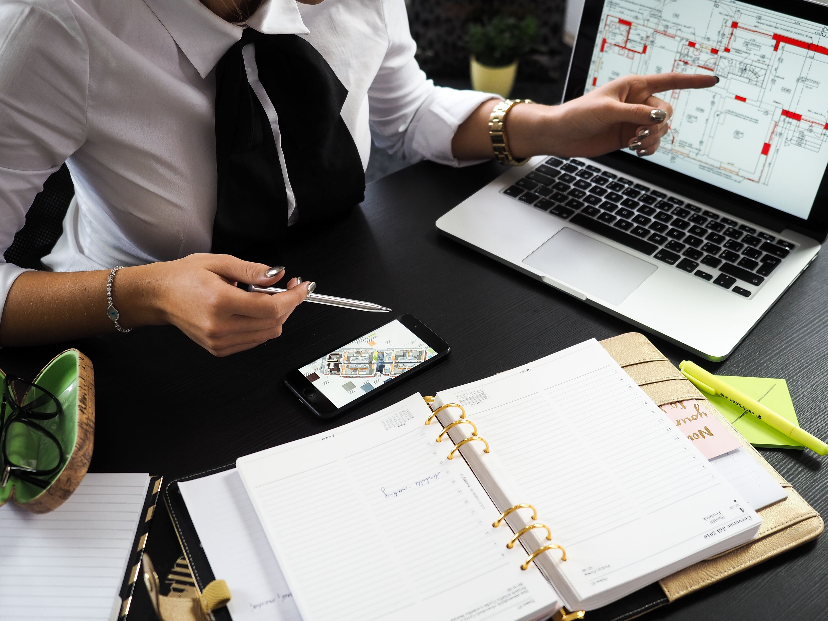 Reviewing a listing plan at a desk